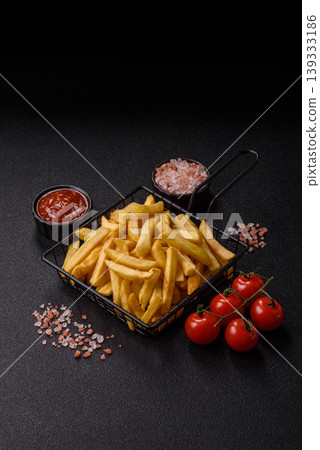 Crispy, fresh, golden French fries with salt, unhealthy takeaway food. French fries 139333186