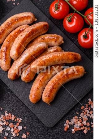 Grilled or barbecued chicken sausages for the dinner table. Grilled sausages 139333233