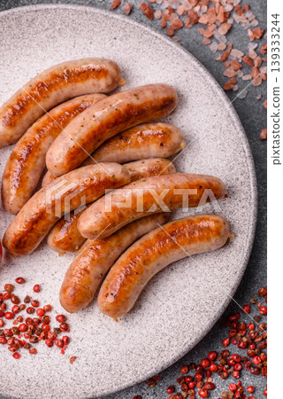 Grilled or barbecued chicken sausages for the dinner table. Grilled sausages Grilled or barbecued chicken sausages for the dinner table. Grilled sausages 139333244