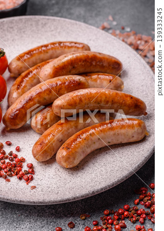Grilled or barbecued chicken sausages for the dinner table. Grilled sausages Grilled or barbecued chicken sausages for the dinner table. Grilled sausages 139333245