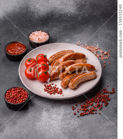 Grilled or barbecued chicken sausages for the dinner table. Grilled sausages Grilled or barbecued chicken sausages for the dinner table. Grilled sausages 139333248