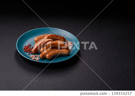 Grilled or barbecued chicken sausages for the dinner table. Grilled sausages Grilled or barbecued chicken sausages for the dinner table. Grilled sausages 139333257