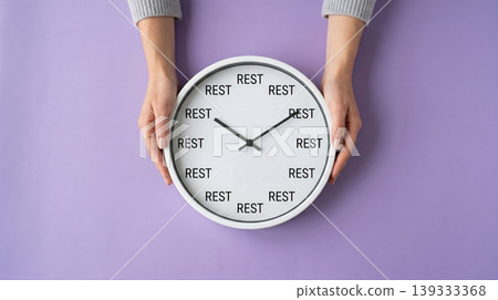 Female Hands Holding Clock with REST Text Relaxation and Work Life Balance Concept Female Hands Holding Clock with REST Text Relaxation and Work Life Balance Concept 139333368