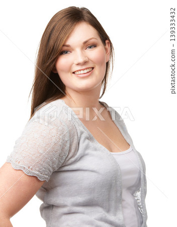Portrait, smile and fashion with a plus size woman in studio isolated on a white background for style. Face, happy and clothes with a trendy young body positive model in a casual clothing outfit Portrait, smile and fashion with a plus size woman in studio isolated on a white background for style. Face, happy and clothes with a trendy young body positive model in a casual clothing outfit 139333432