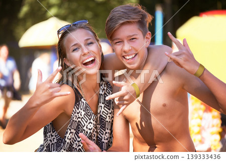 Portrait, woman and man at music festival with smile, nature and hug in forest for concert event. Relax, celebration at outdoor party with freedom and adventure, happy people with trees and sunshine. 139333436