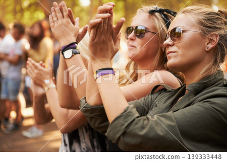 Hands, applause and woman friends at a music festival outdoor for a concert, party or event of celebration. Audience, crowd or young people at a carnival together for performance or entertainment 139333448