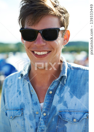 Smile, portrait or happy man at outdoor music festival for concert, party or event in nature. Face, sunglasses or male person enjoying sound outside in sunshine at carnival in summer for celebration Smile, portrait or happy man at outdoor music festival for concert, party or event in nature. Face, sunglasses or male person enjoying sound outside in sunshine at carnival in summer for celebration 139333449