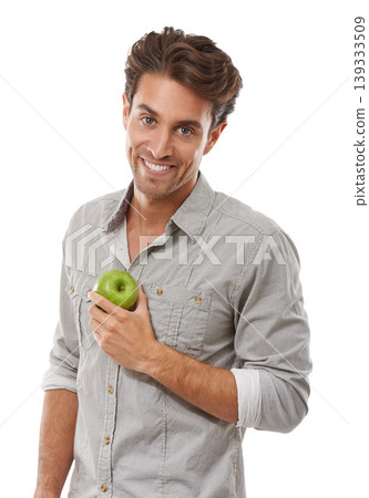 Portrait, smile and man with apple, food and healthy diet isolated on a white background in studio. Face, happy person and green fruit for nutrition, vegan and wellness benefits, vitamin c or organic 139333509
