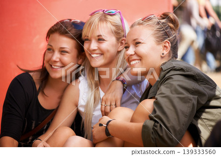 Happy, reunion or friends in music festival on holiday vacation together to relax with smile. Outdoor party, youth culture or excited gen z women in concert for a fun memory or celebration event Happy, reunion or friends in music festival on holiday vacation together to relax with smile. Outdoor party, youth culture or excited gen z women in concert for a fun memory or celebration event 139333560
