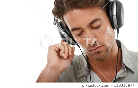 Man, headphones and calm music in studio for audio subscription, streaming multimedia and radio on white background. Face of model listening to peaceful podcast, hearing sound or song at mockup space Man, headphones and calm music in studio for audio subscription, streaming multimedia and radio on white background. Face of model listening to peaceful podcast, hearing sound or song at mockup space 139333674