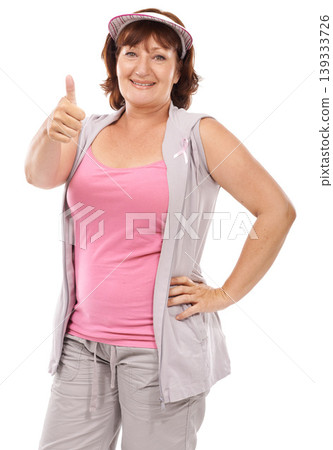 Mature woman portrait, breast cancer ribbon and thumbs up for awareness, disease recovery fitness or support agreement. Emoji like icon, survivor feedback or model studio campaign on white background 139333726