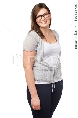 Casual fashion, portrait and plus size model with smile, glasses and isolated on white background. Self love, body positivity and happy woman with natural beauty, wellness and inclusion in studio. Casual fashion, portrait and plus size model with smile, glasses and isolated on white background. Self love, body positivity and happy woman with natural beauty, wellness and inclusion in studio. 139333780