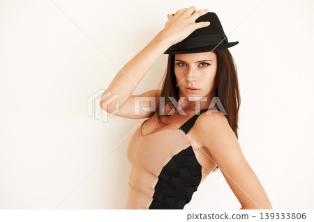 Woman, vintage fashion and confidence in portrait, wall background and pride for cool clothing. Female person, style and hat or face by backdrop, retro and creative outfit or beauty and cosmetics Woman, vintage fashion and confidence in portrait, wall background and pride for cool clothing. Female person, style and hat or face by backdrop, retro and creative outfit or beauty and cosmetics 139333806