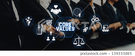 Business Team Emphasizing Core Values with Iconography Symbolizing Ethics, Collaboration, Goals, Innovation, and Integrity in a Professional Setting Fluxor Business Team Emphasizing Core Values with Iconography Symbolizing Ethics, Collaboration, Goals, Innovation, and Integrity in a Professional Setting Fluxor 139333865