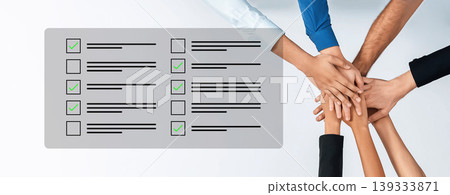 Collaborative Teamwork Scene Depicting Diverse Hands Over Checklist Signifying Completion of Tasks with Positive Attitude in a Professional Setting Cyphers. Collaborative Teamwork Scene Depicting Diverse Hands Over Checklist Signifying Completion of Tasks with Positive Attitude in a Professional Setting Cyphers. 139333871