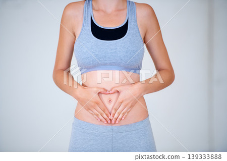 Heart, hands on stomach and woman for fitness, workout and exercise to lose weight. Happy, gut health and person with emoji, symbol or shape on tummy for wellness, digestion and diet for healthy body Heart, hands on stomach and woman for fitness, workout and exercise to lose weight. Happy, gut health and person with emoji, symbol or shape on tummy for wellness, digestion and diet for healthy body 139333888