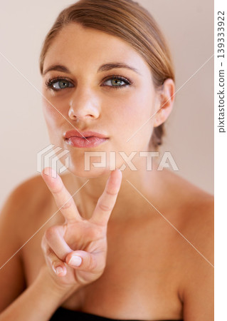 Beauty, portrait and woman with peace sign for self care wellness, facial cosmetics aesthetic or spa salon routine. Face makeup, dermatology treatment and model with emoji V icon on studio background 139333922