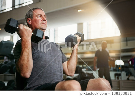 Fitness, gym and senior man with dumbbells for weightlifting, challenge or cardio workout, training or bodybuilding. Biceps, arms and elderly person with hand weight for strength, mindset or exercise Fitness, gym and senior man with dumbbells for weightlifting, challenge or cardio workout, training or bodybuilding. Biceps, arms and elderly person with hand weight for strength, mindset or exercise 139333931