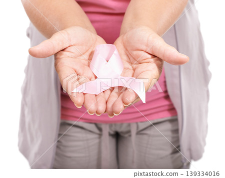 Studio person, breast cancer ribbon and hands show bow awareness icon, kindness or activism support. Health wellness care, recognition campaign or closeup model giving compassion on white background Studio person, breast cancer ribbon and hands show bow awareness icon, kindness or activism support. Health wellness care, recognition campaign or closeup model giving compassion on white background 139334016