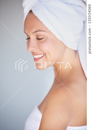 Profile of happy woman, natural beauty or towel for wellness in house bathroom for glow or detox. Morning, relax or confident model with skincare results, self care or healthy skin for dermatology Profile of happy woman, natural beauty or towel for wellness in house bathroom for glow or detox. Morning, relax or confident model with skincare results, self care or healthy skin for dermatology 139334060