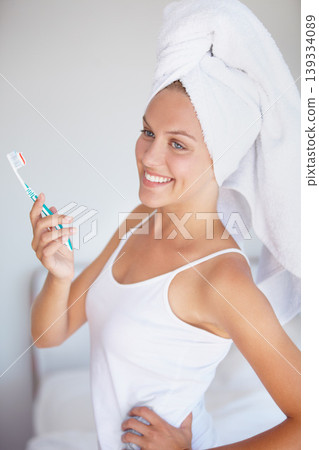 Woman, brushing teeth and smile in bathroom for hygiene healthy mouth, gum dental care or wellness. Female person, toothbrush and whitening routine for orthodontics, breath cleaning or gingivitis 139334089