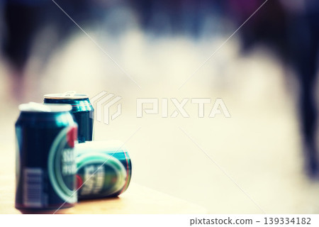 Space, blurred background and cans of beer closeup outdoor at a music festival for drinking or celebration. Party, product and alcohol with lager or ale at a carnival for the enjoyment of a beverage Space, blurred background and cans of beer closeup outdoor at a music festival for drinking or celebration. Party, product and alcohol with lager or ale at a carnival for the enjoyment of a beverage 139334182