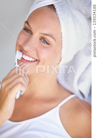 Woman, brushing teeth and smile for healthy in bathroom for hygiene mouth, gum dental care or wellness. Female person, toothbrush and whitening routine for orthodontics, oral glow or gingivitis shine 139334188