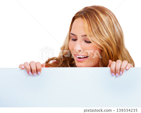 Woman, poster and peeking at information in studio for news communication, announcement or white background. Female person, billboard placard as mockup space for promotion, advertising or signage 139334235