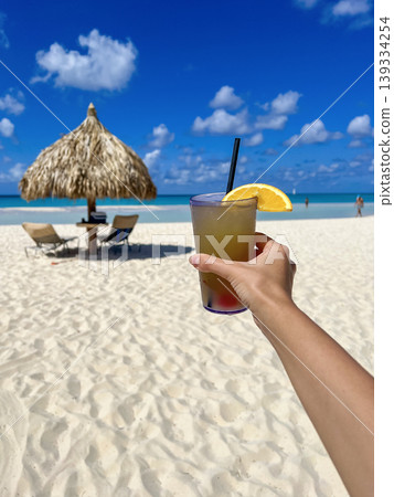 Cheers with Tropical Cocktails on Sunny Aruba Beach Cheers with Tropical Cocktails on Sunny Aruba Beach 139334254