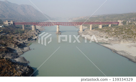 Attock red rail bridge spanning indus in broad landscape pakistan haze Attock red rail bridge spanning indus in broad landscape pakistan haze 139334329