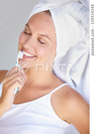Woman, brushing teeth and smile for healthy care in bathroom for hygiene mouth, dental gum or wellness. Female person, toothbrush and whitening routine for orthodontics, oral glow or gingivitis shine Woman, brushing teeth and smile for healthy care in bathroom for hygiene mouth, dental gum or wellness. Female person, toothbrush and whitening routine for orthodontics, oral glow or gingivitis shine 139334348