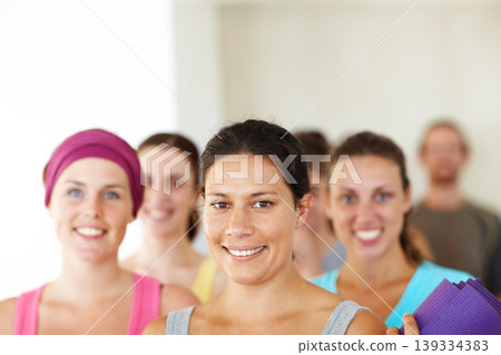 Portrait, yoga or training and woman with a group of people in a studio for health, wellness or mindfulness. Fitness, training and pilates with happy young friends in gym class for holistic exercise Portrait, yoga or training and woman with a group of people in a studio for health, wellness or mindfulness. Fitness, training and pilates with happy young friends in gym class for holistic exercise 139334383