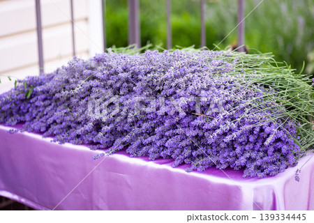 Cut lavender flowers on table. Making bouquets and sachets of lavender harvest at home 139334445