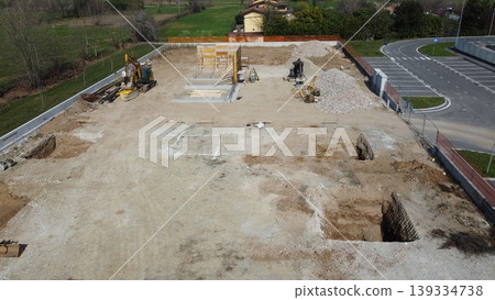 Aerial view of a construction site for a new industrial building Aerial view of a construction site for a new industrial building 139334738