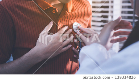 Doctor using a stethoscope checking patient with examining, presenting results symptom and recommend treatment method, Healthcare and medical concept Doctor using a stethoscope checking patient with examining, presenting results symptom and recommend treatment method, Healthcare and medical concept 139334826