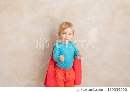 Little boy dressed as a superhero having fun at home Little boy dressed as a superhero having fun at home 139334960