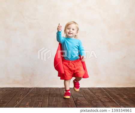 Little boy dressed as a superhero having fun at home Little boy dressed as a superhero having fun at home 139334961