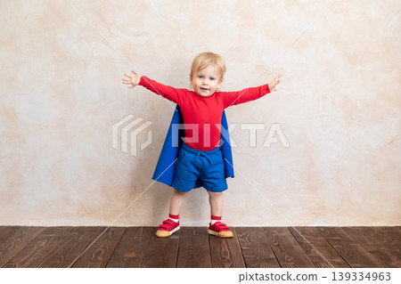 Little boy dressed as a superhero having fun at home Little boy dressed as a superhero having fun at home 139334963