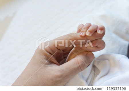 A hand of a newly born baby A hand of a newly born baby 139335196
