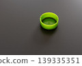 green plastic bottle cap on gray background 139335351