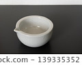 white porcelain laboratory mortar on gray background. 139335352