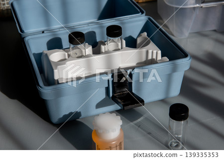 Portable water testing kit with sample vials and container Portable water testing kit with sample vials and container 139335353