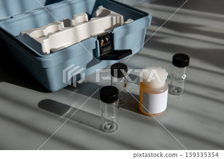 Portable water testing kit with sample vials and container Portable water testing kit with sample vials and container 139335354