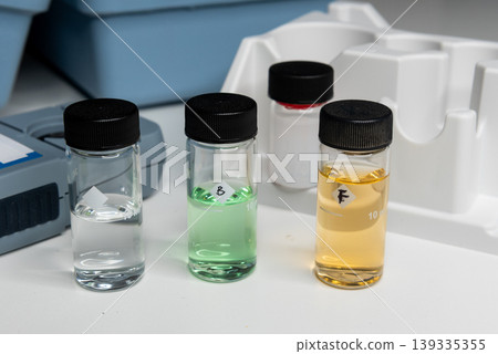 Portable water testing kit with sample vials and container 139335355
