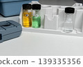 Portable water testing kit with sample vials and container 139335356