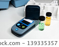 Portable water testing kit with sample vials and container 139335357