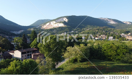Botticino landscape with a mountain quarry and poppy field Botticino landscape with a mountain quarry and poppy field 139335433