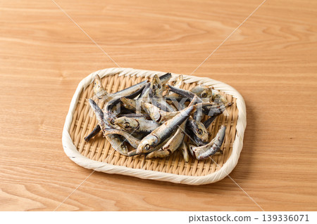 Dried sardines (domestic Japanese anchovies) served in a basket. Dried sardines (domestic Japanese anchovies) served in a basket. 139336071