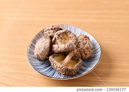 Dried shiitake mushrooms served on a plate Dried shiitake mushrooms served on a plate 139336177
