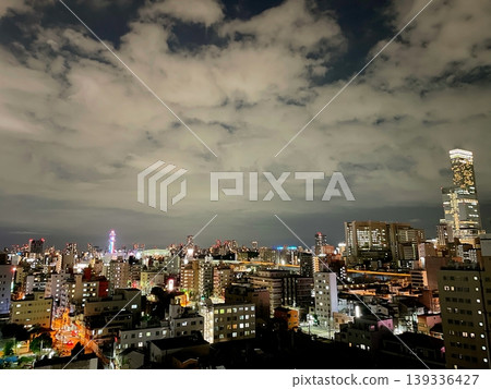 A city night view with clouds spreading across it. A city night view with clouds spreading across it. 139336427